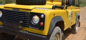 yellow landrover in algarve hills off-road